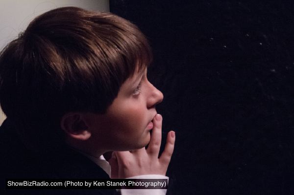 Patrick (Austin Brannan) is excited to watch the events at Mame's party.